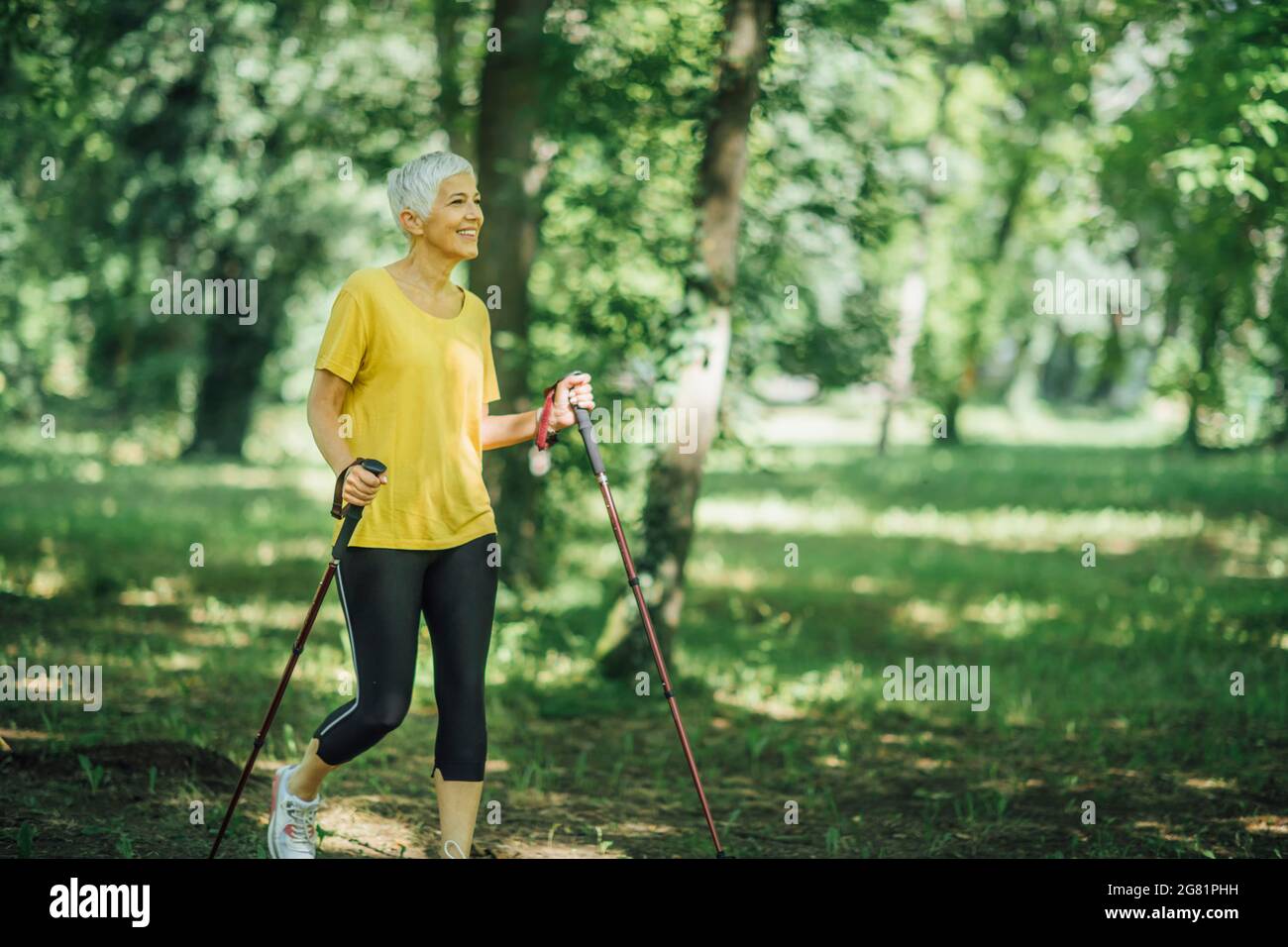 Mature woman walk poles hi-res stock photography and images - Alamy