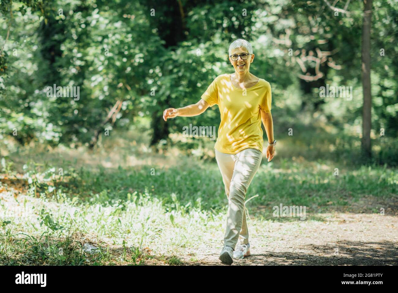 Walking mature woman hi-res stock photography and images - Alamy