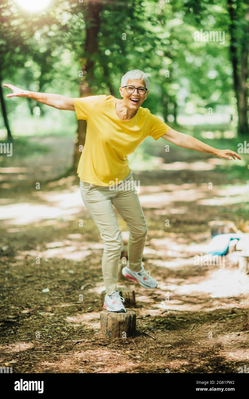Balancing exercise outdoors Stock Photo - Alamy