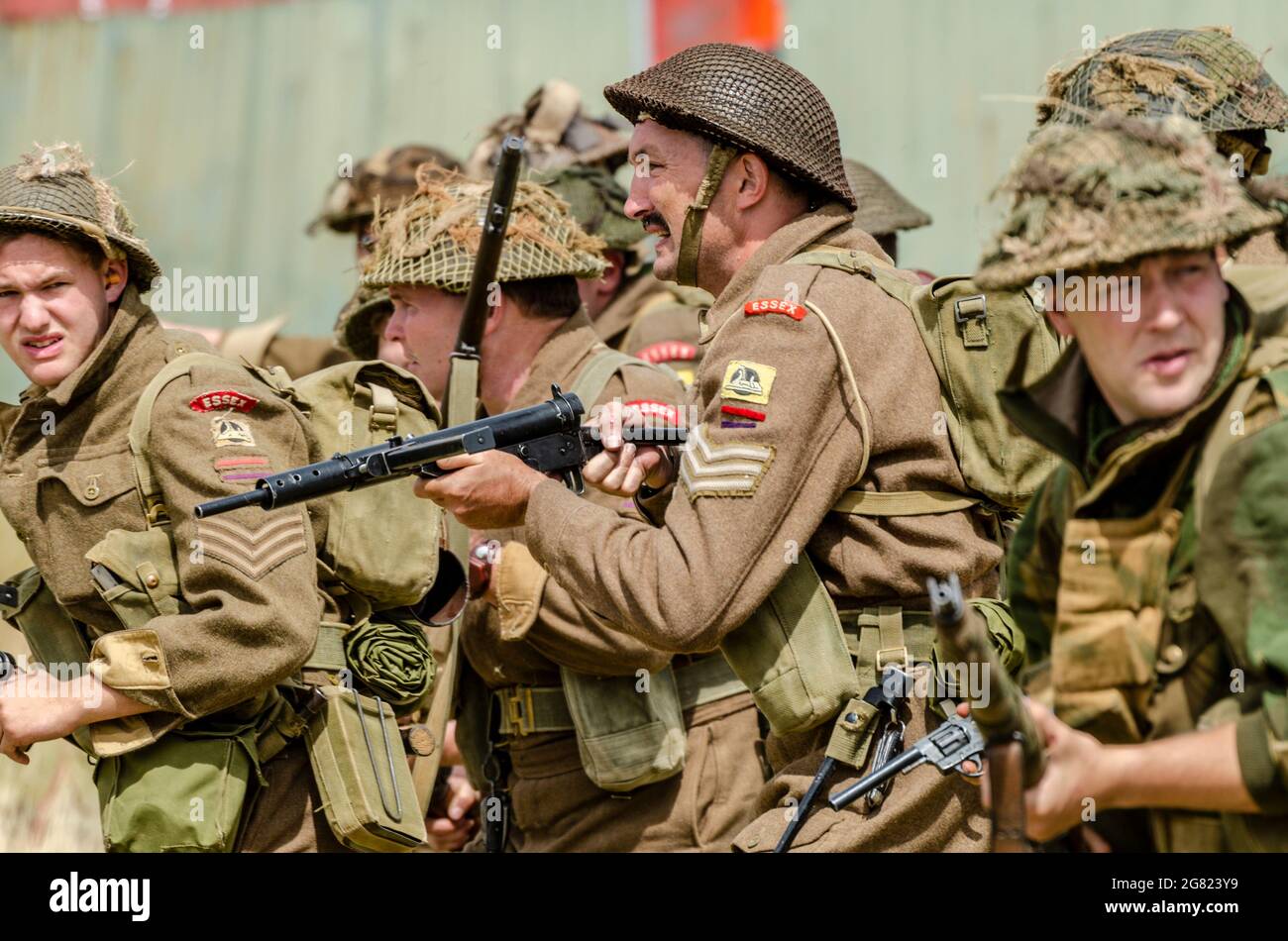 Re-enactors re-enacting a Second World War battle, with Essex regiment ...