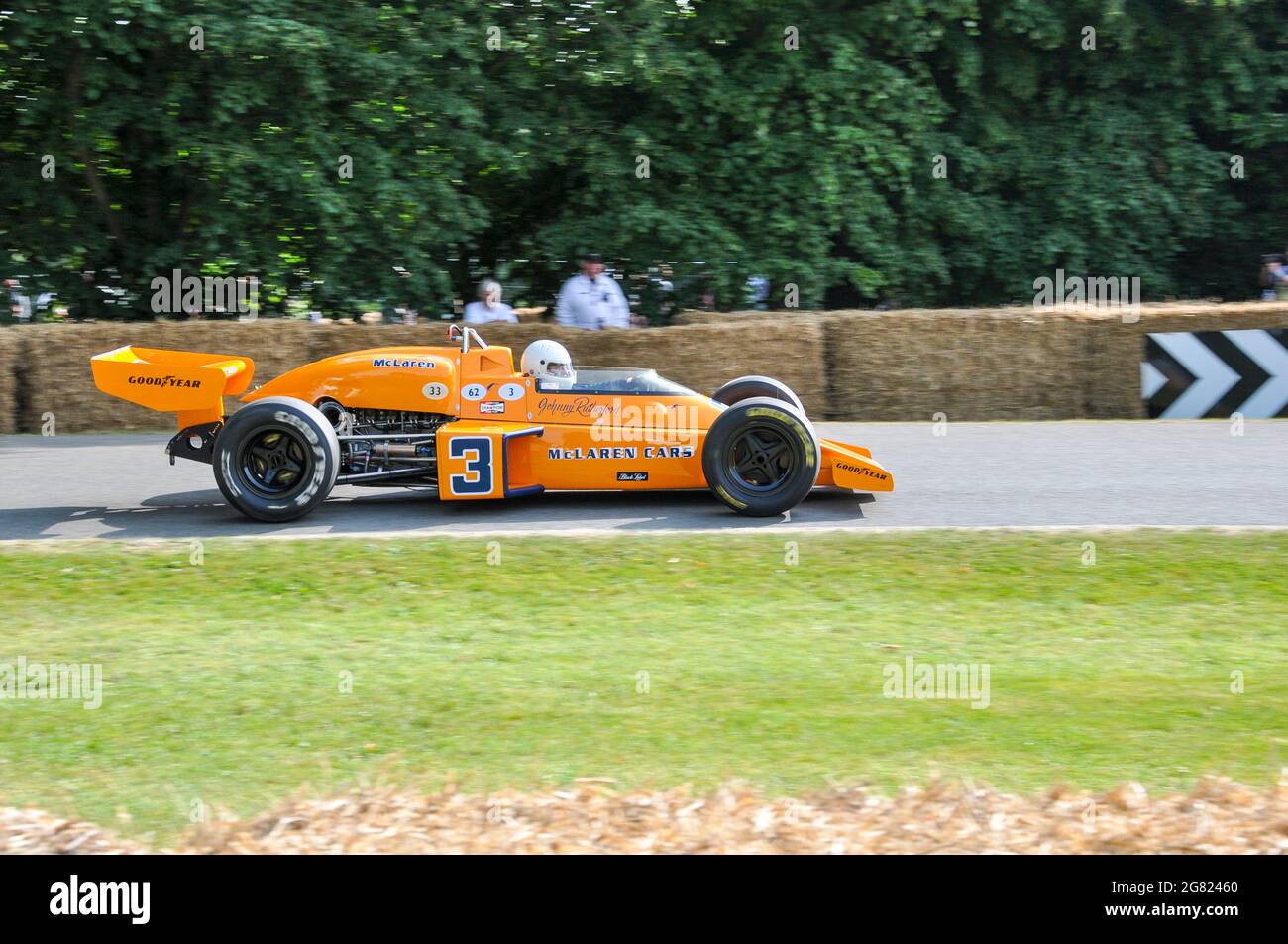 McLaren M16 racing up the hill climb at the Goodwood Festival of Speed 2013. Car in which Johnny Rutherford won the 1974 Indianapolis 500 Stock Photo