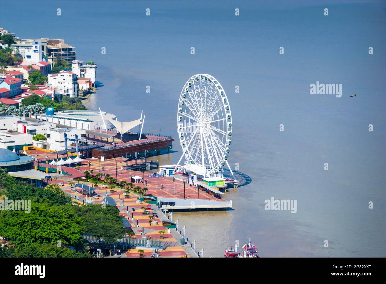 A top aerial view of Guayaquil city in Ecuador. Buildings, Malecon 2000, La Perla ferris wheel and the Guayas river. Stock Photo