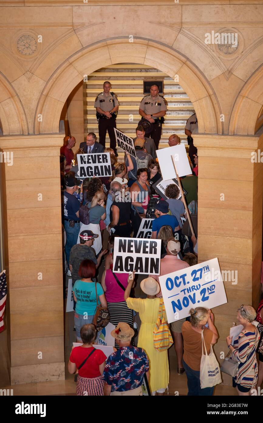 St. Paul, Minnesota. Police officers block the protesters from entering the room at the capitol while the senate is in session. They are demanding the Stock Photo