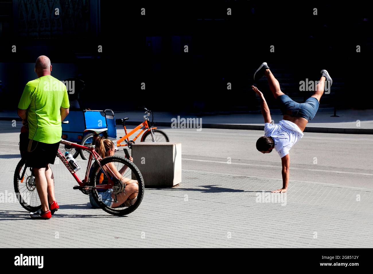A man strikes a pose for a photo outside the Sagrada Familia, Barcelona. Stock Photo