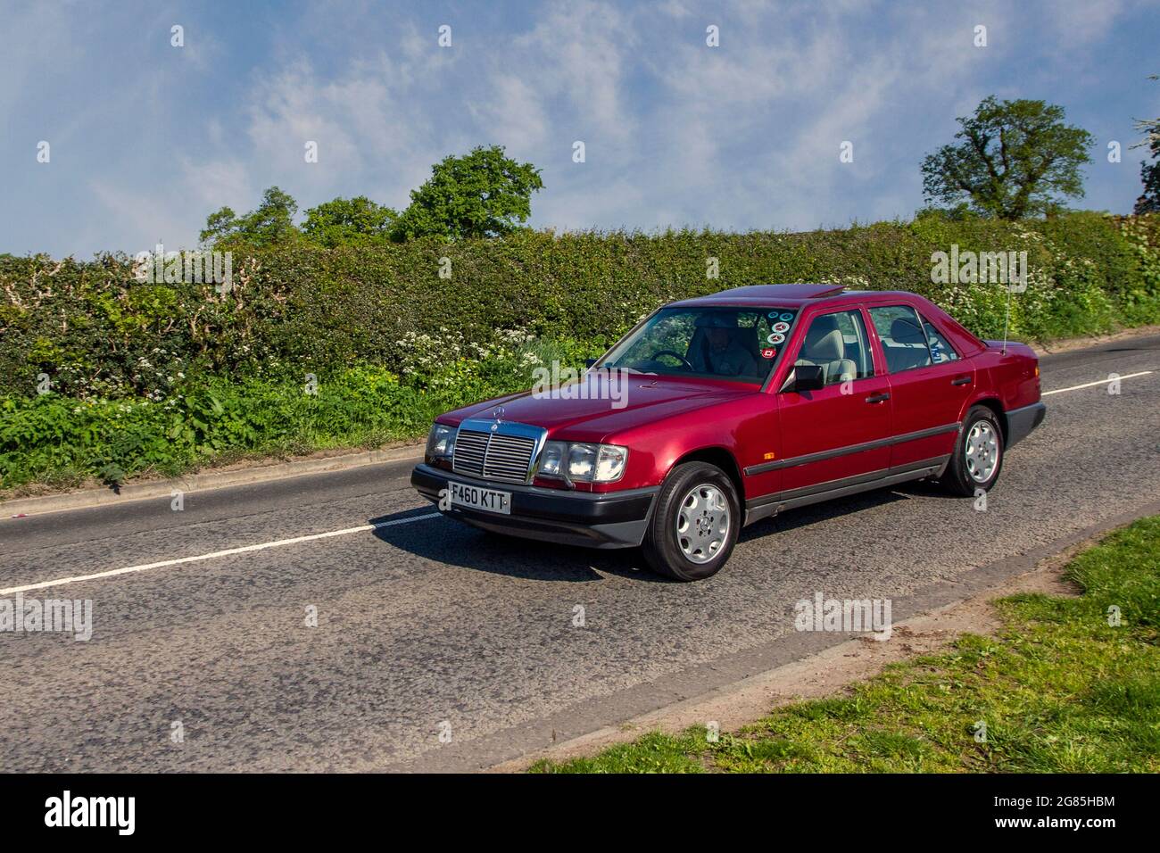 1989 80s Mercedes Benz 260 E Auto 2599cc petrol saloon en-route to Capesthorne Hall classic May car show, Cheshire, UK Stock Photo