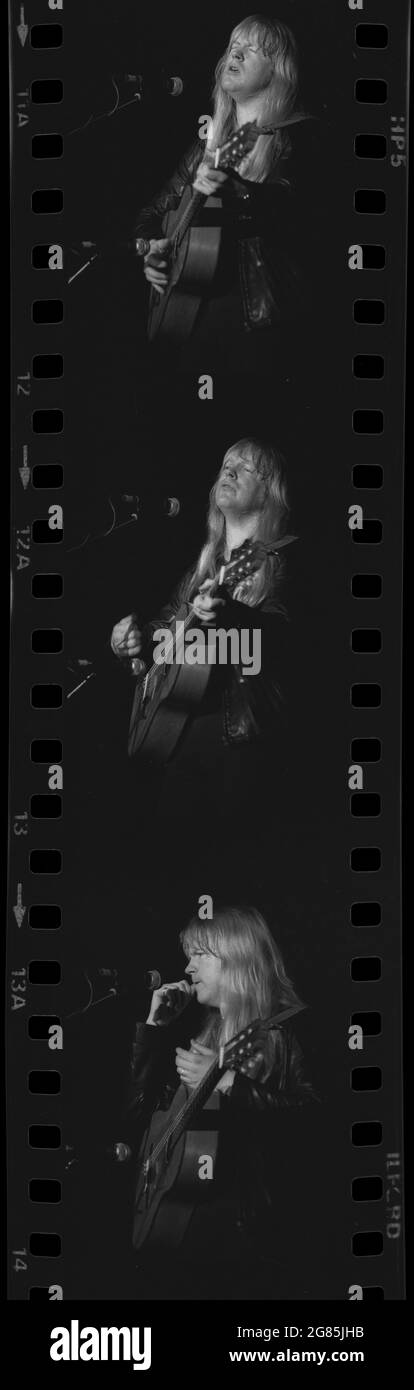 black and white series of Christian rock musician, Larry Norman, performing at a concert in Brisbane, Australia, December 1982 Stock Photo