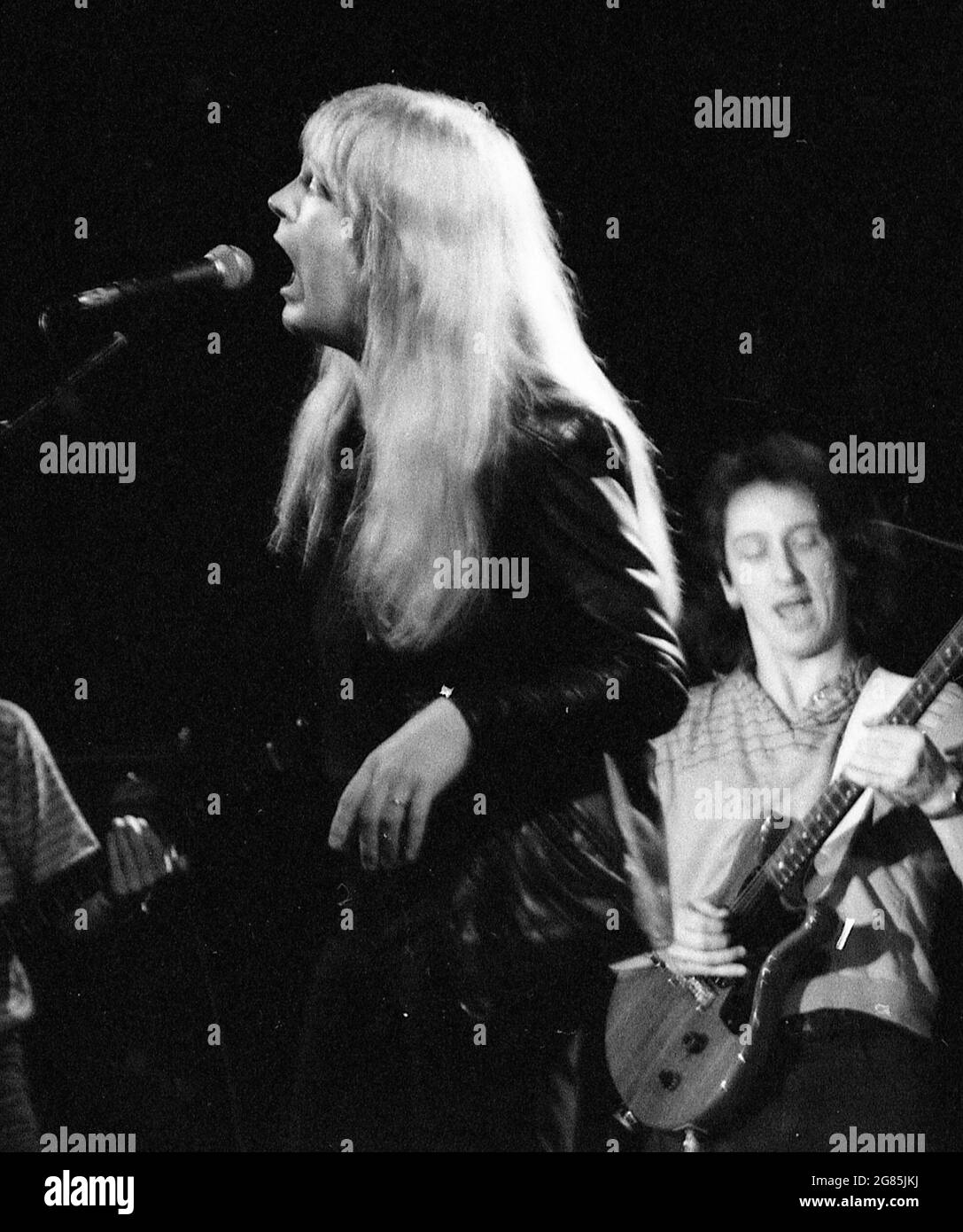 black and white image of Christian rock musician, Larry Norman, performing at a concert in Brisbane, Australia, December 1982 Stock Photo