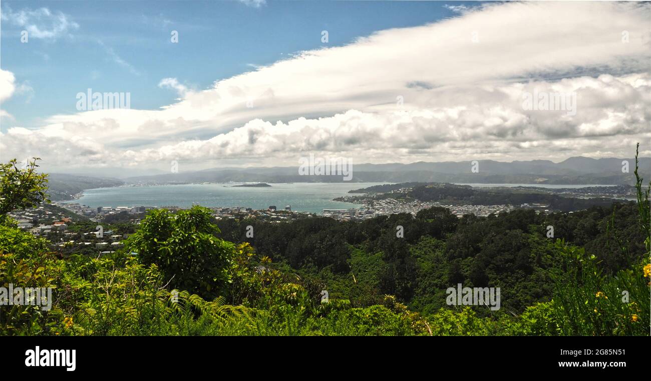A big cloud front over Wellington city & harbourf, looking down from the eco sanctuary Zealandia Stock Photo