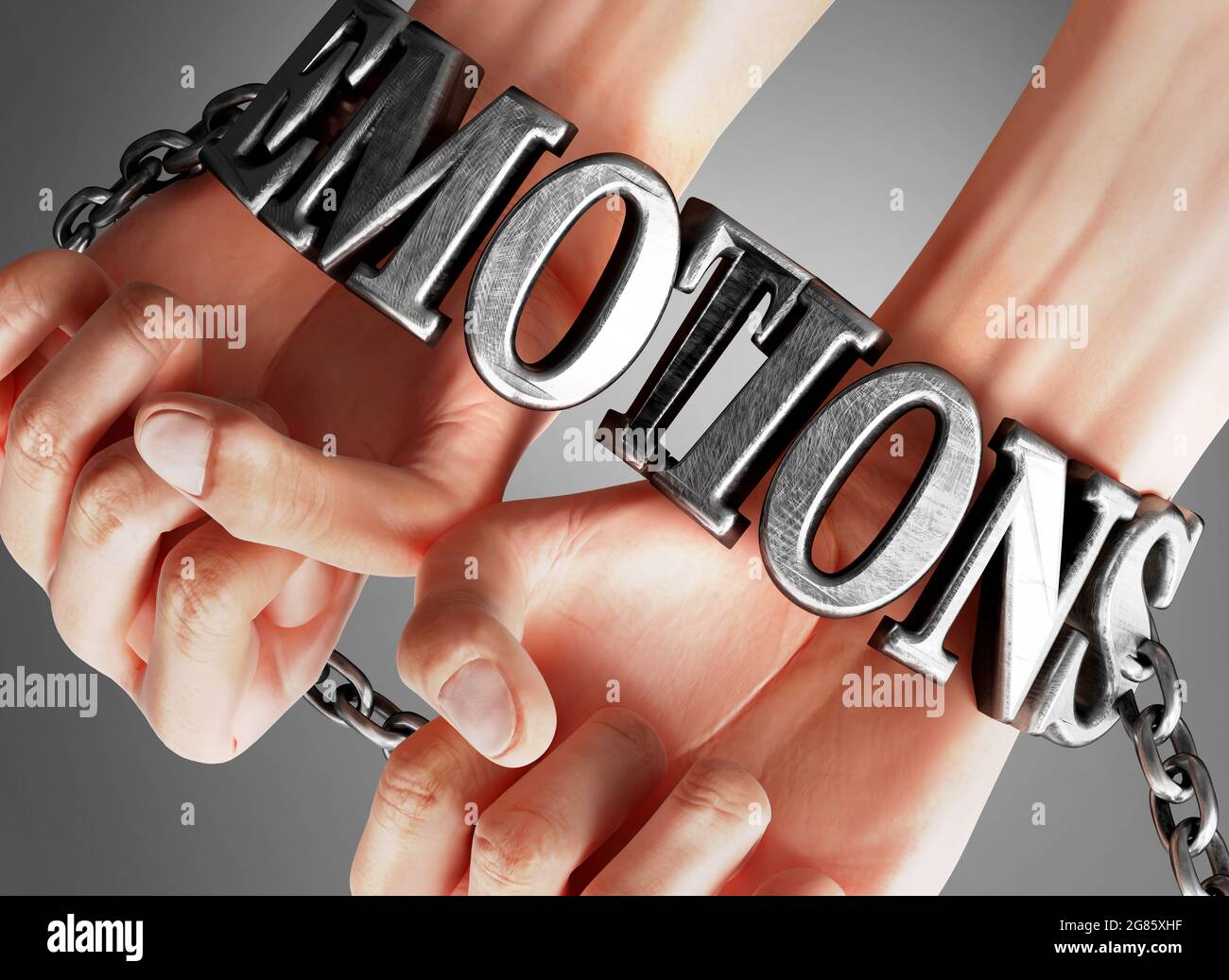 Emotions restricting life and freedom, bringing enslavement, pain and misery to human life - symbolized by chains and shackles made of metal word Emot Stock Photo