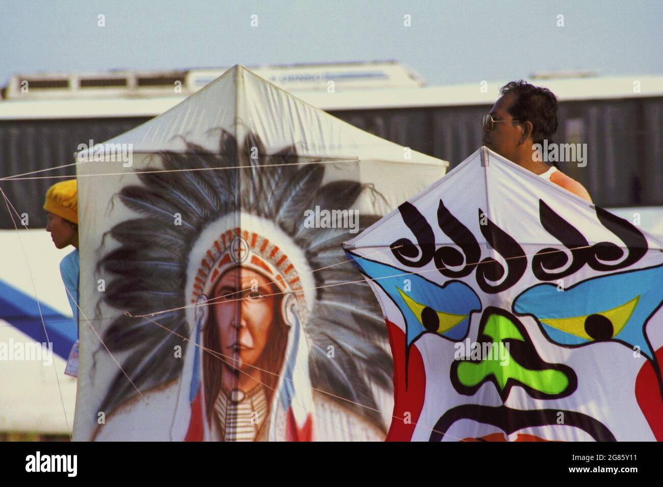 People holding kites during the 2004 Jakarta International Kite Festival that held on July 9-11 at Carnival Beach in Ancol Dreamland, North Jakarta, Jakarta, Indonesia. Stock Photo