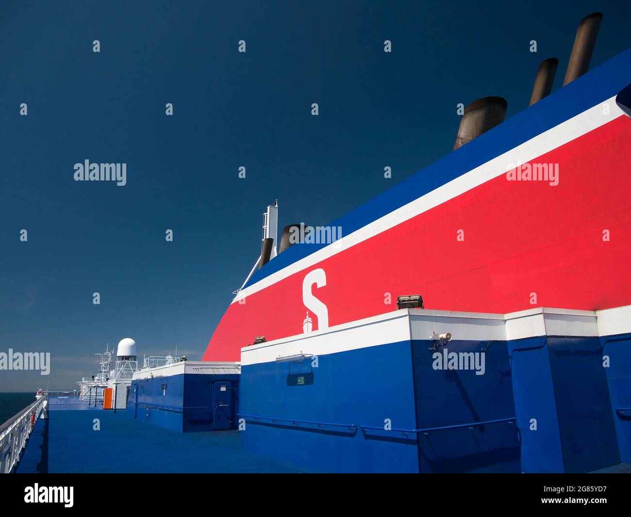The red, white and blue corporate coloured superstructure of the Stena Line roll on roll off ferry operating in the Irish Sea between Birkenhead and B Stock Photo