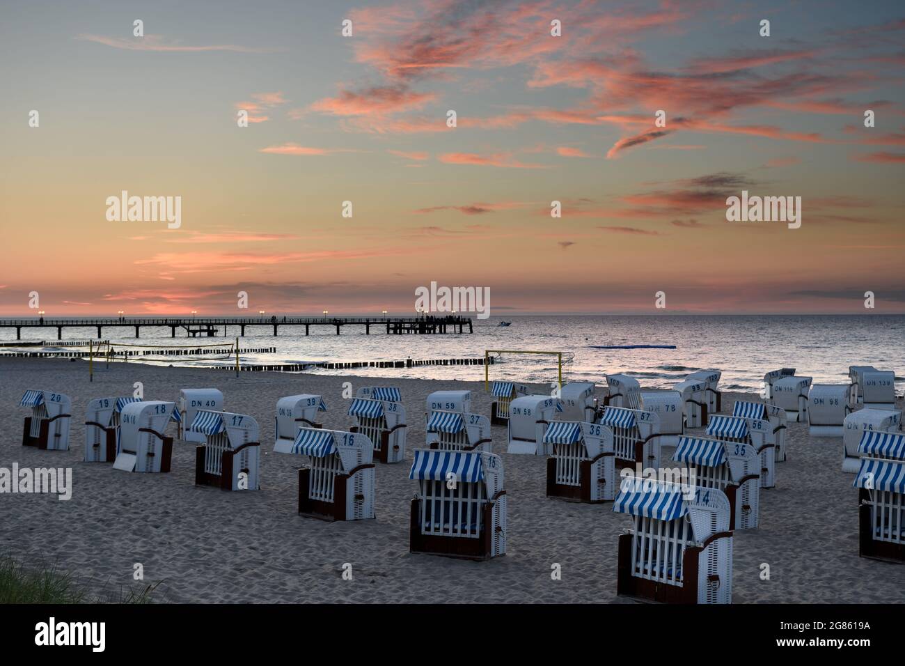 Kuehlungsborn, Germany, Baltic Sea coast: evening atmosphere and sunset at the beach and pier Stock Photo