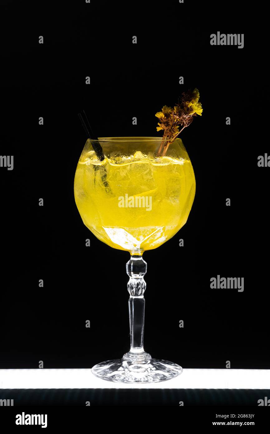 luxury gin hass orange cocktail drink with ice in glass on black background Stock Photo
