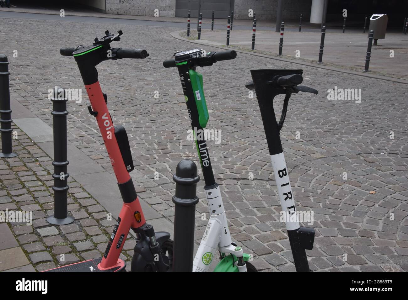 Cologne, Germany. 16th July, 2021. Rental e-scooters from Voi, Bird and Lime  are on the sidewalk. Credit: Horst Galuschka/dpa/Alamy Live News Stock  Photo - Alamy