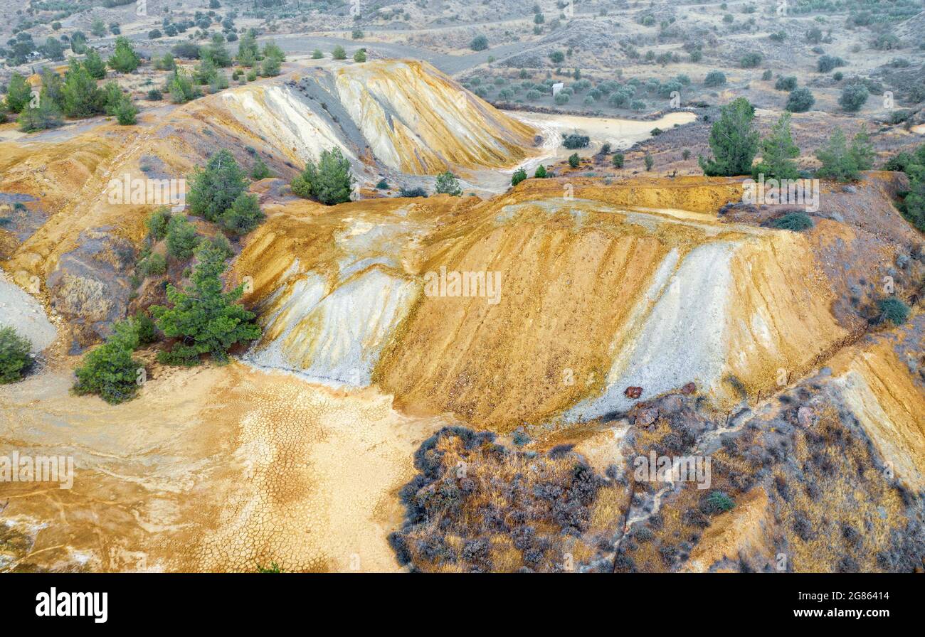 Colorful mine tailings and spoil heaps at abandoned copper mine near Kampia, Cyprus Stock Photo