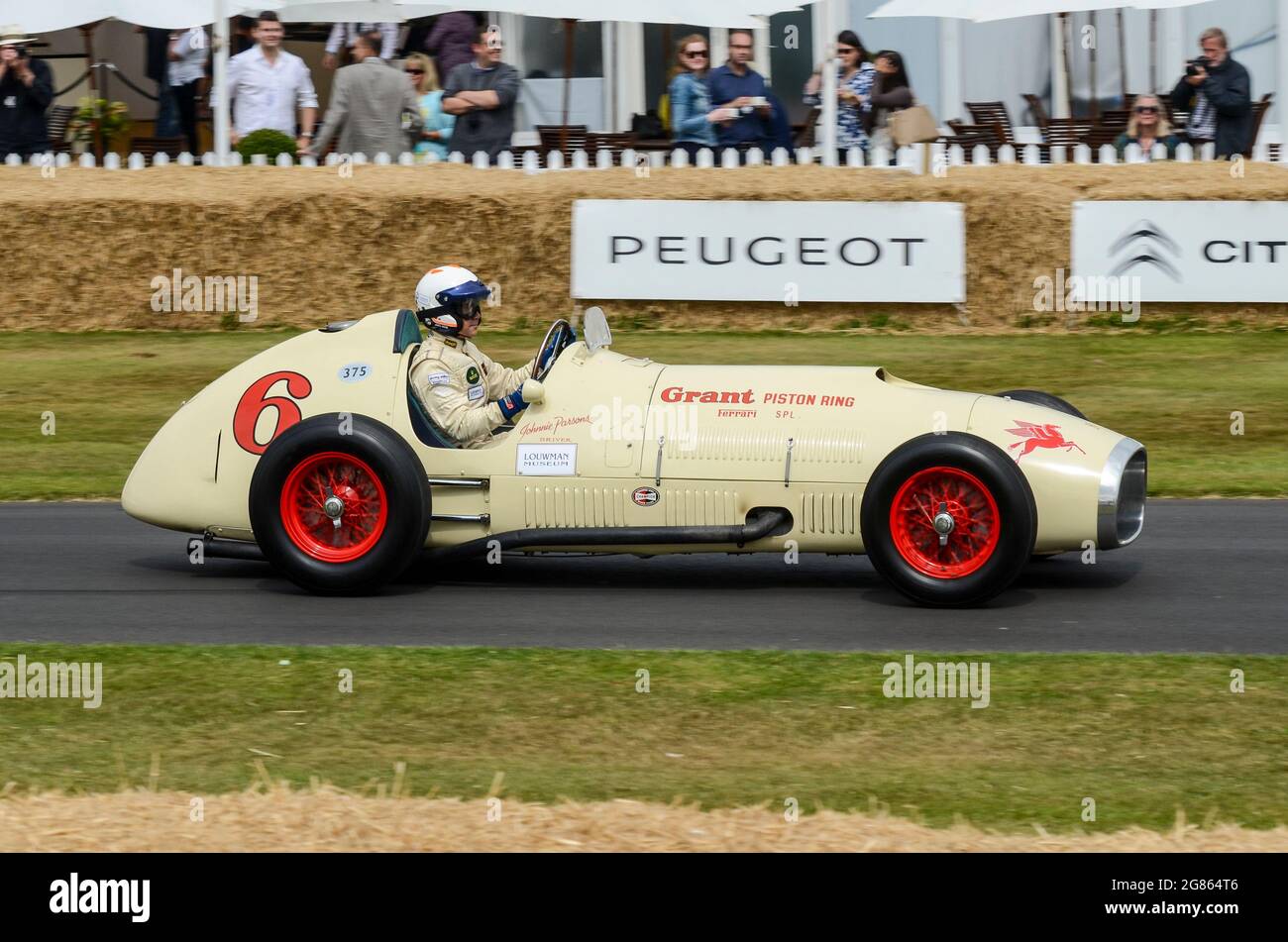 1952 Ferrari 375 'Grant Piston Ring Special' racing up the hill climb at the Goodwood Festival of Speed 2013. Grand Prix car adapted to race Indy 500 Stock Photo