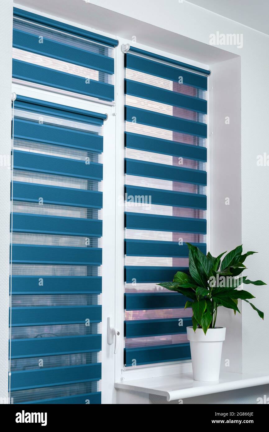 Windows with closed modern horizontal blinds indoors closeup
