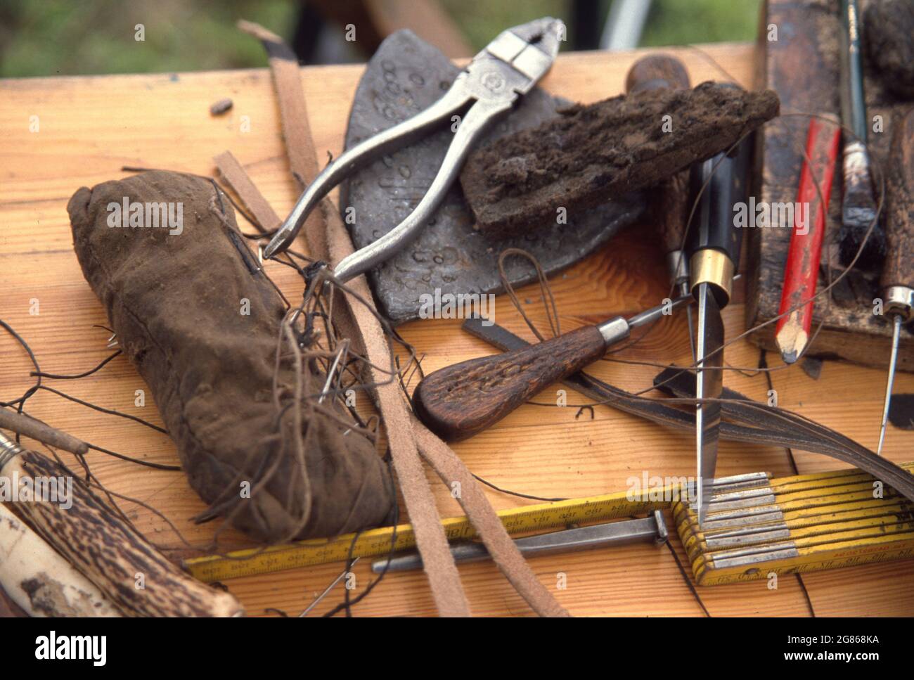 Handwork cutting leather and working  with old tools Stock Photo