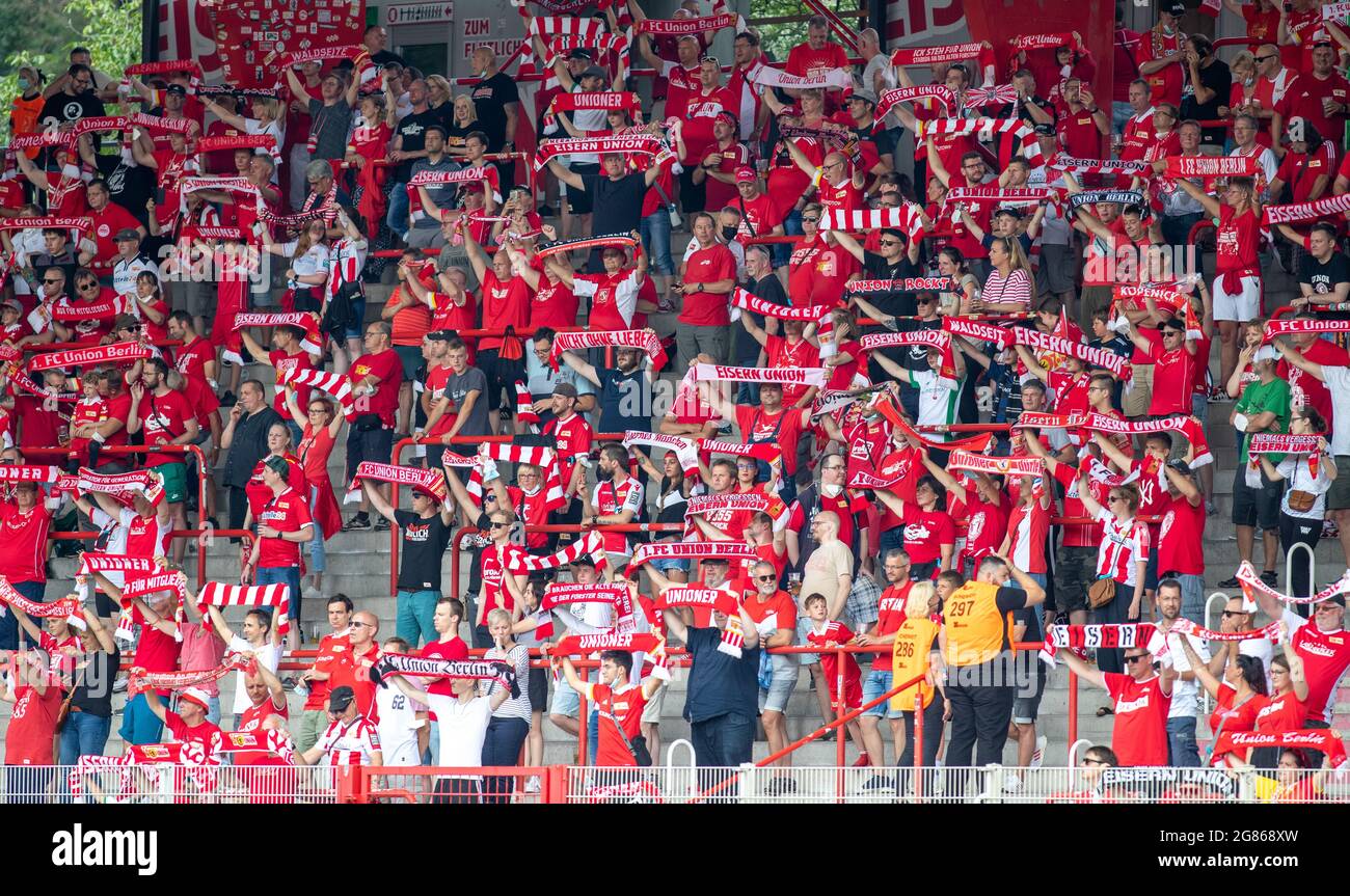 Berlin, Germany. 17th July, 2021. Football: Test matches, 1. FC Union Berlin  - Dynamo Dresden, Stadion An der Alten Försterei. Union Berlin fans cheer  on their team with scarves. Credit: Andreas Gora/dpa/Alamy