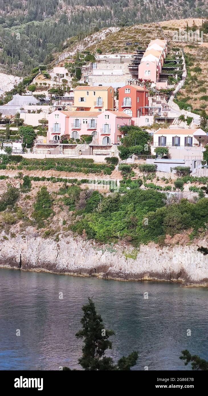 The traditional architecture, the peaceful landscape and the pebbled beaches compose the natural beauty of Assos - a small and charming village. Stock Photo