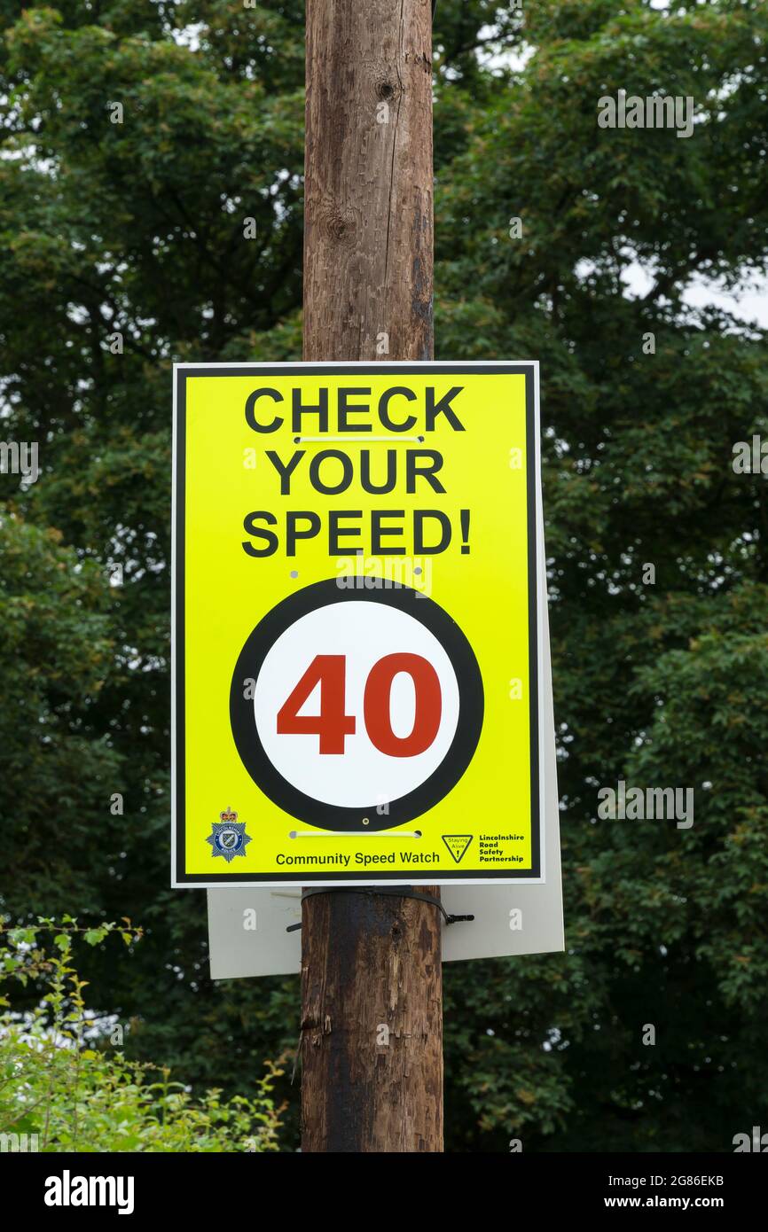 Check your speed sign 40 MPH on post Stock Photo Alamy