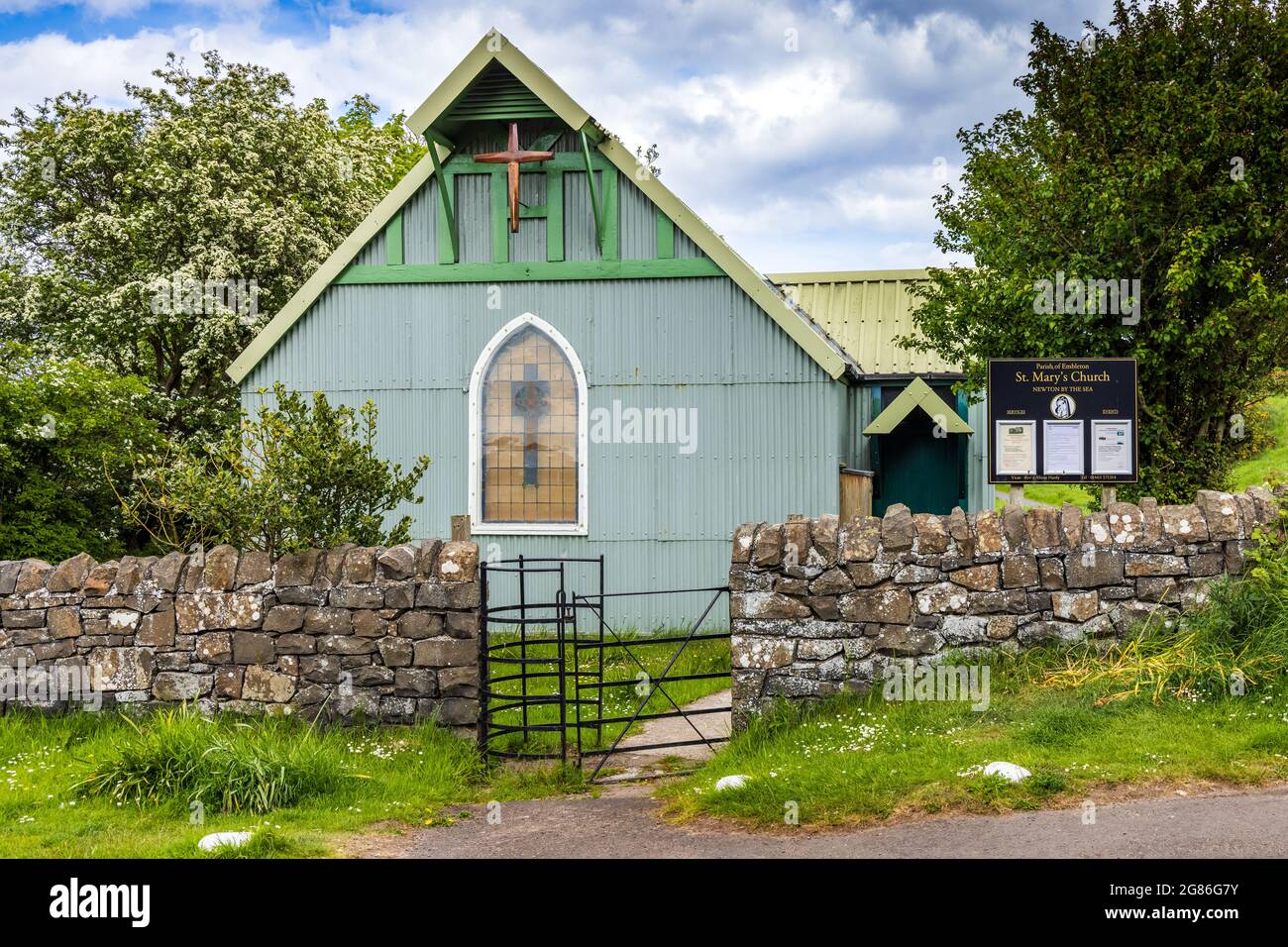 The unusual, corrugated iron Church of St Mary sits beside the road between High Newton-by-the-Sea and Low Newton-by-the-Sea in Northumberland. Stock Photo
