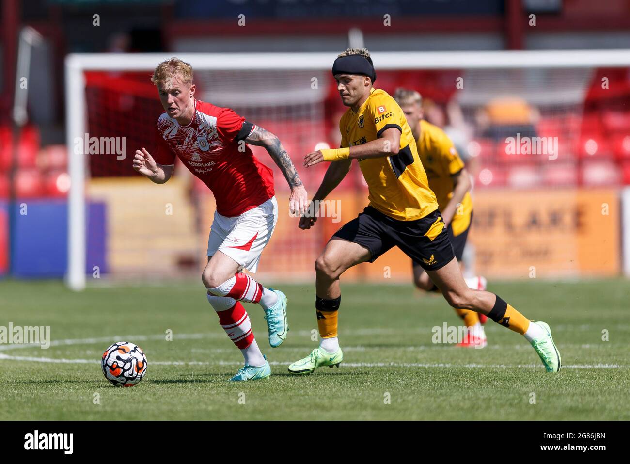 Crewe, UK. 17th July, 2021. Charlie Kirk of Crewe Alexandra and Raul Jimenez of Wolverhampton Wanderers during the Pre-Season Friendly match between Crewe Alexandra and Wolverhampton Wanderers at Alexandra Stadium on July 17th 2021 in Crewe, England. (Photo by Daniel Chesterton/phcimages.com) Credit: PHC Images/Alamy Live News Stock Photo