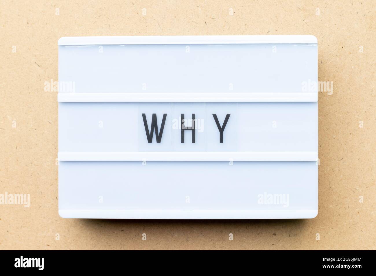 White lightbox with word why on wood background Stock Photo
