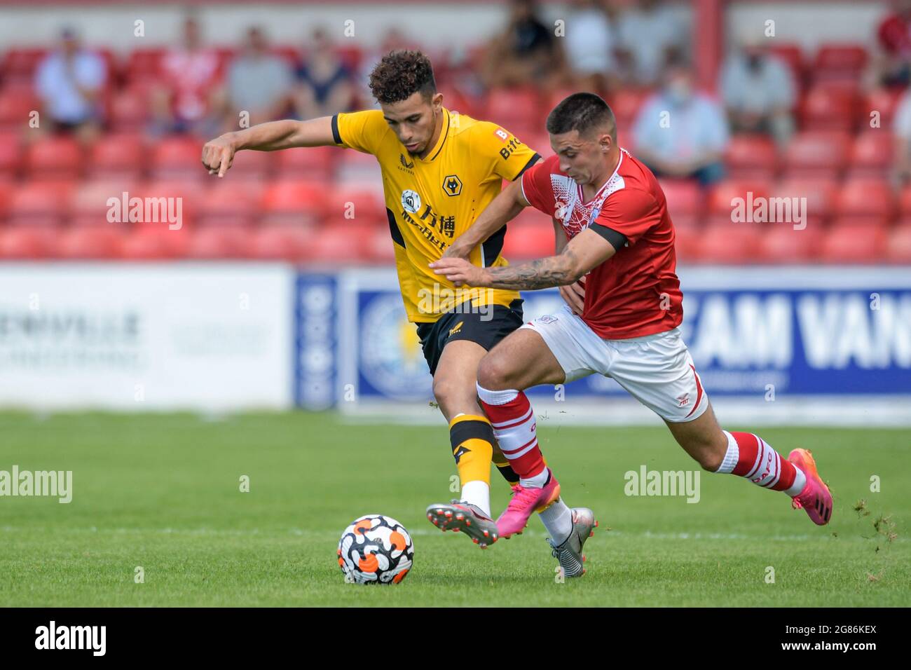 Crewe, UK. 17th July, 2021. Rayan Ait-Nouri #3 of Wolverhampton Wanderers holds off the challenge from Owen Dale #11 of Crewe Alexandra in Crewe, United Kingdom on 7/17/2021. (Photo by Simon Whitehead/News Images/Sipa USA) Credit: Sipa USA/Alamy Live News Stock Photo