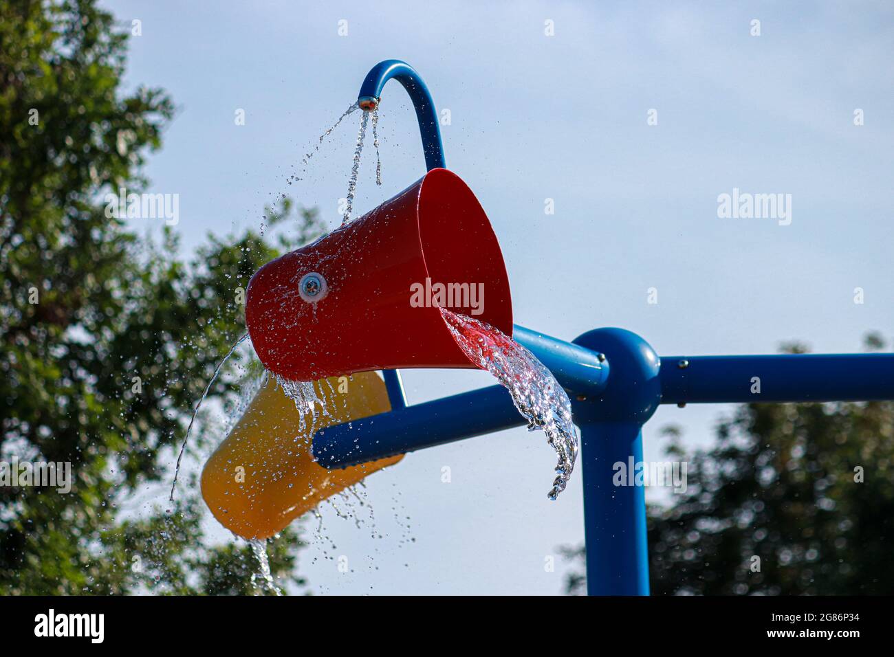 Tipping Water Park Bucket Stock Photo Alamy