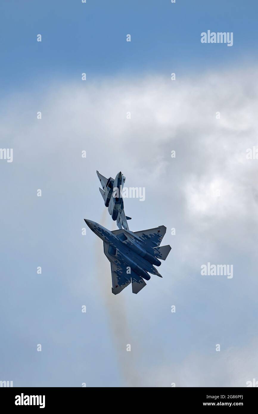 New Russian five generation's fighters SU 57, T-50 shows aerial maneuver battle at Moscow International Aviation and Space Salon MAKS 2019. RUSSIA Stock Photo