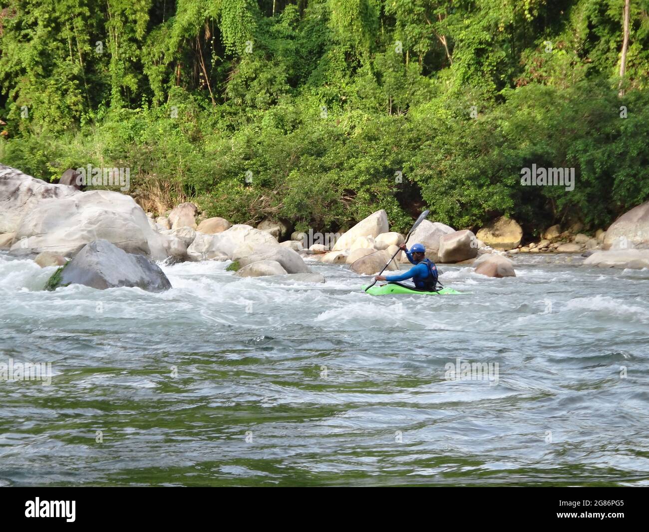 BARINAS, VENEZUELA - Apr 18, 2021: A person water rafting in Acequia river in Barinas, Venezuela Stock Photo