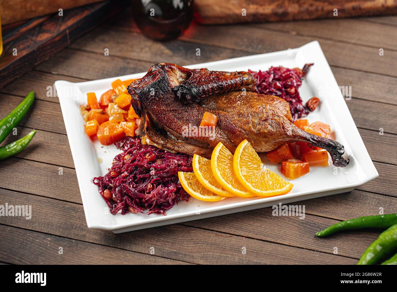 Dish of roast peking duck with different salads Stock Photo Alamy