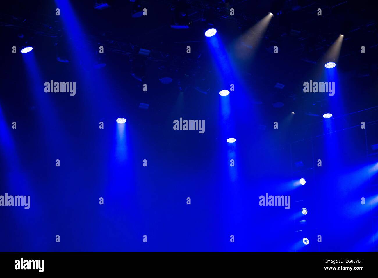 Stage lights glowing in the dark. Live music festival concept background Stock Photo