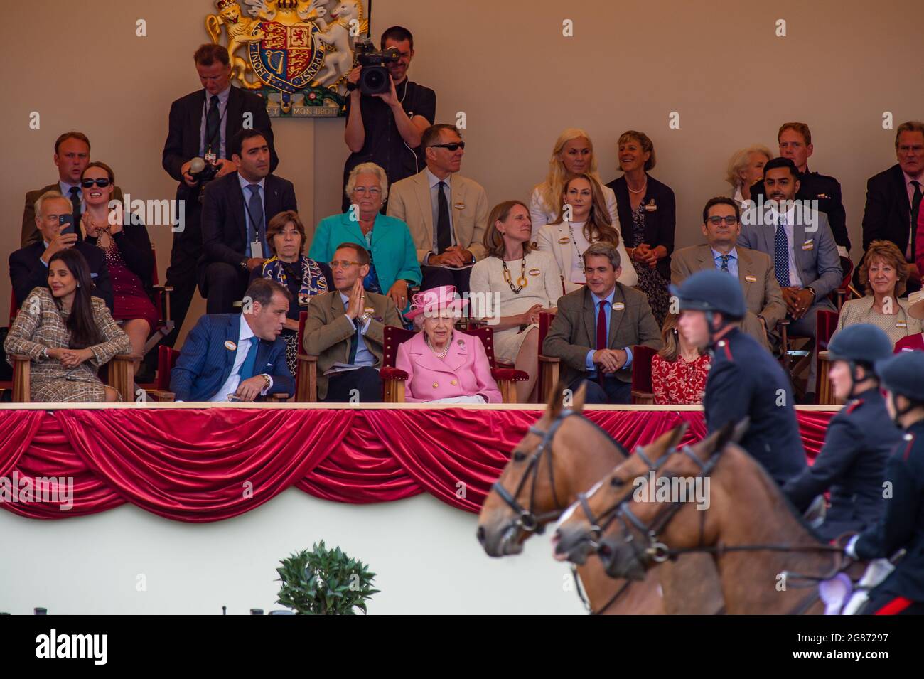 Windsor, Berkshire, UK. 3rd July, 2021. Queen Elizabeth II wore a pale pink coat and hat this afternoon in the Royal Box at Royal Windsor Horse Show as she watched the Land Rover Services Team Jumping Parade. Credit: Maureen McLean/Alamy Stock Photo