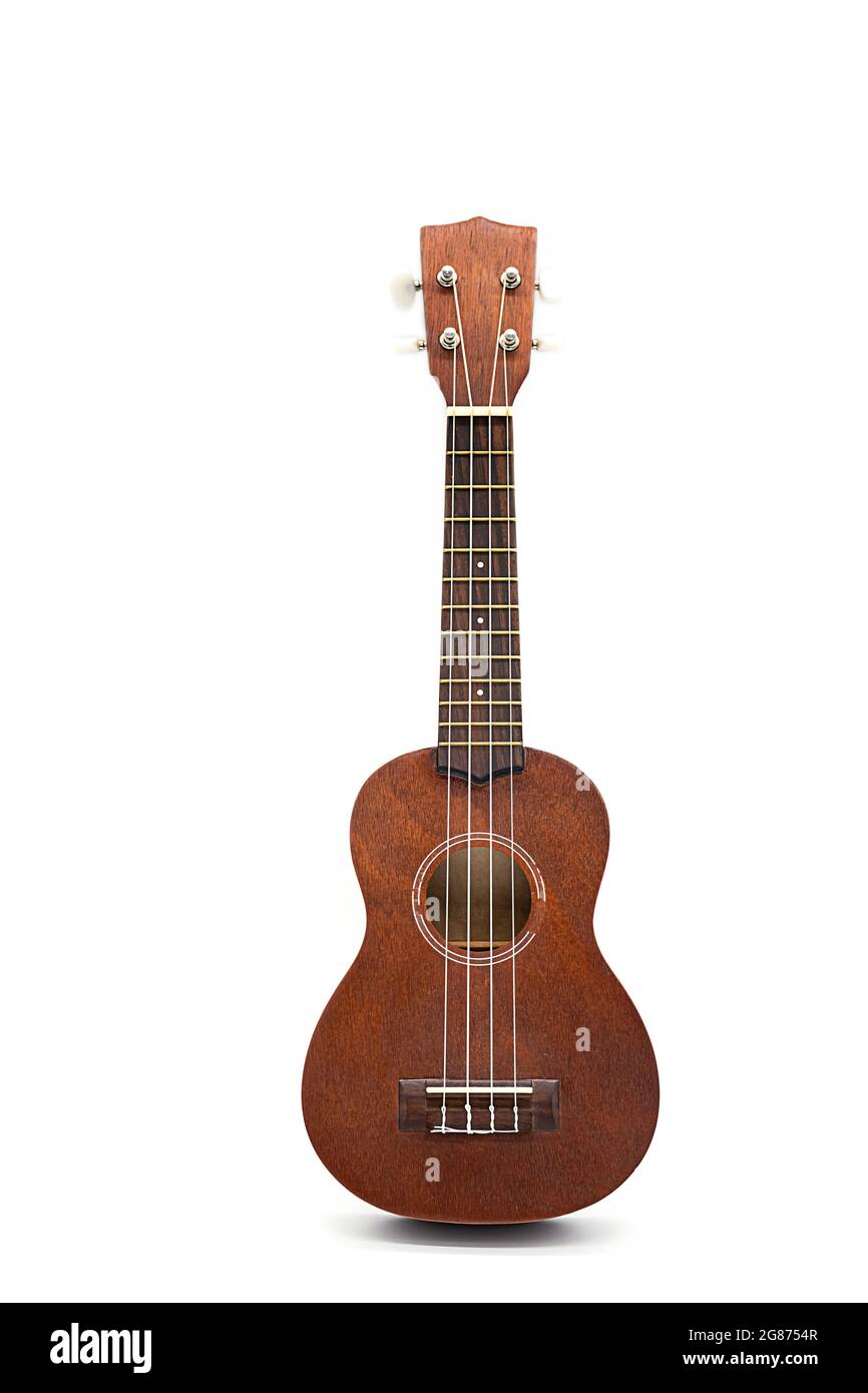 Ukulele guitar isolated on white. Brown acoustic guitar Stock Photo