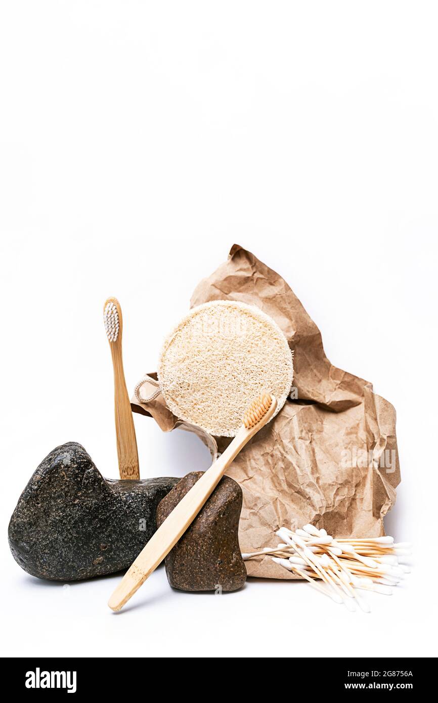 Trendy, minimal still life with natural beauty products and stones. Zero waste bath accessories. Balance composition of bamboo toothbrushes, l Stock Photo