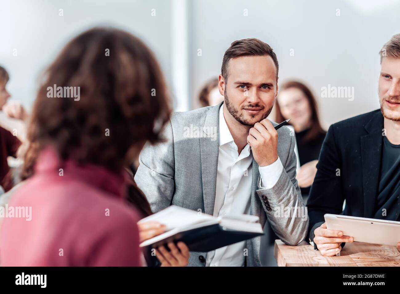 close up. brooding young entrepreneur sitting at office Desk. Stock Photo