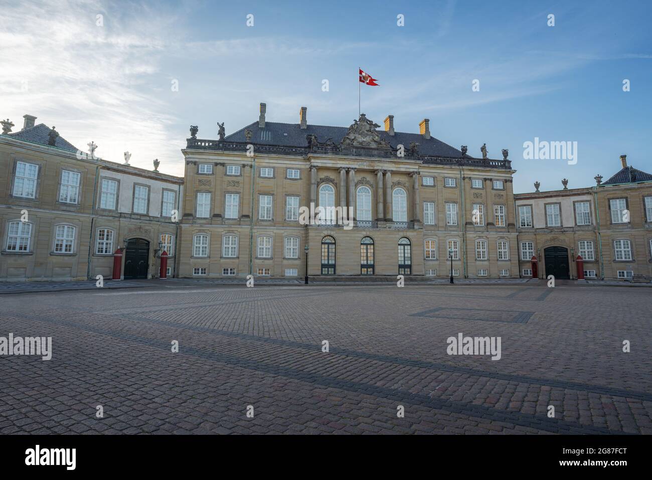 Amalienborg Palace - Christian VIII's Palace with the Royal House Standard - Copenhagen, Denmark Stock Photo