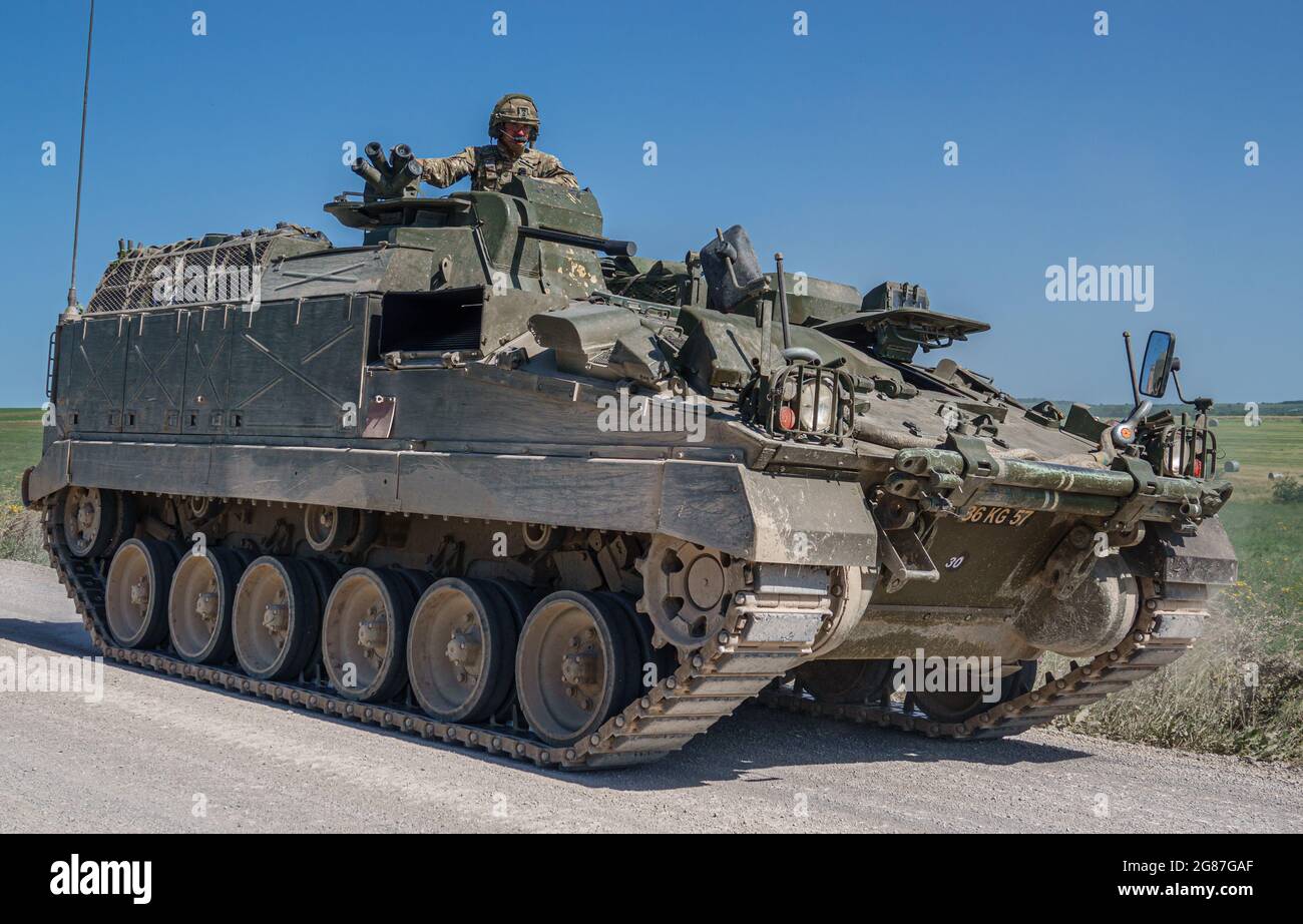 British army Warrior FV512 mechanised recovery vehicle tank in action on military exercise, Salisbury Plain, Wiltshire UK Stock Photo