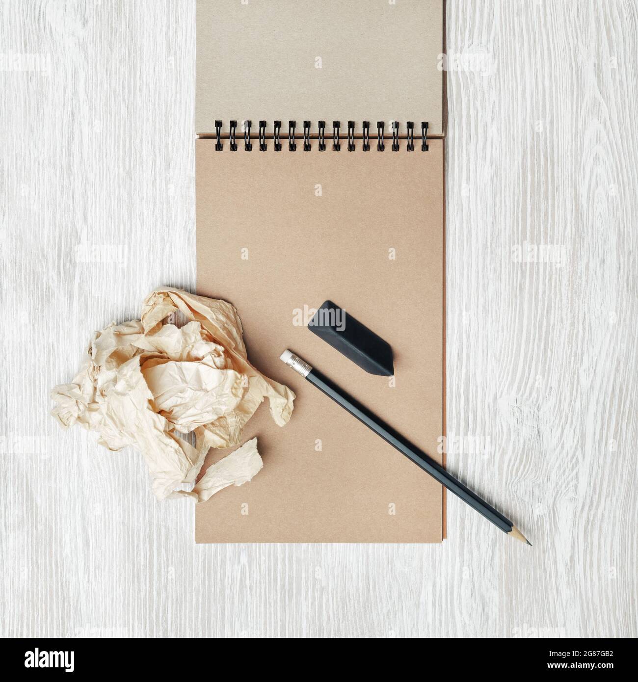 Vintage stationery set. Blank notepad, pencil, eraser and crumpled ...