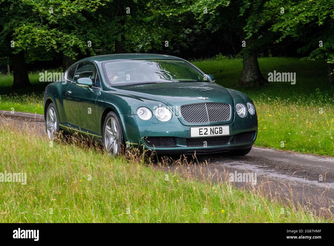 A Green Bentley Continental Gt Auto Car Coupe at ‘The Cars the Star Show” in Holker Hall & Gardens, Grange-over-Sands, UK Stock Photo