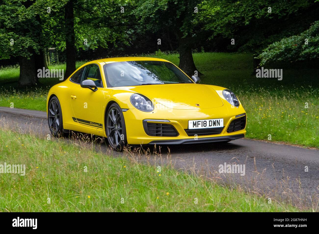 2018 yellow Porsche Carrera T 2981cc roadster at ‘The Cars the Star Show” in Holker Hall & Gardens, Grange-over-Sands, UK Stock Photo