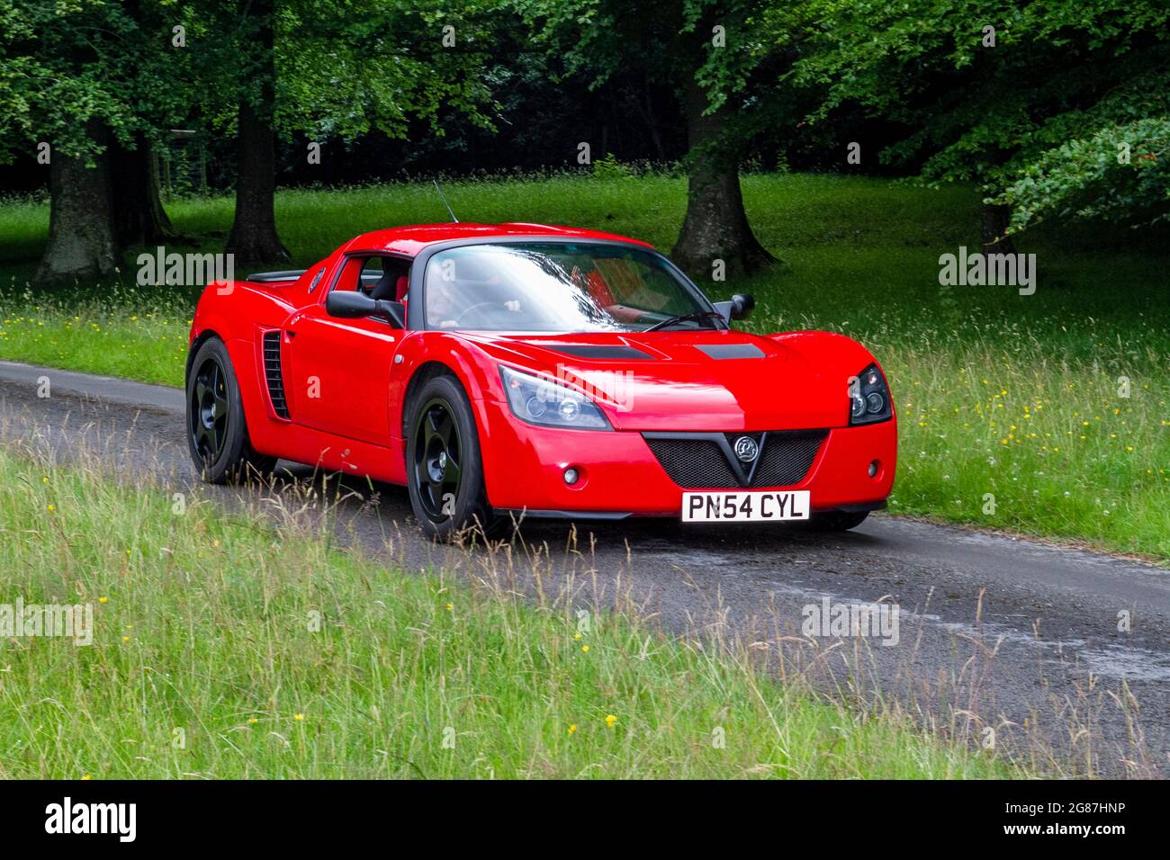 2004 (54) Turbo red Vauxhall 5 speed manual at ‘The Cars the Star Show” in Holker Hall & Gardens, Grange-over-Sands, UK Stock Photo