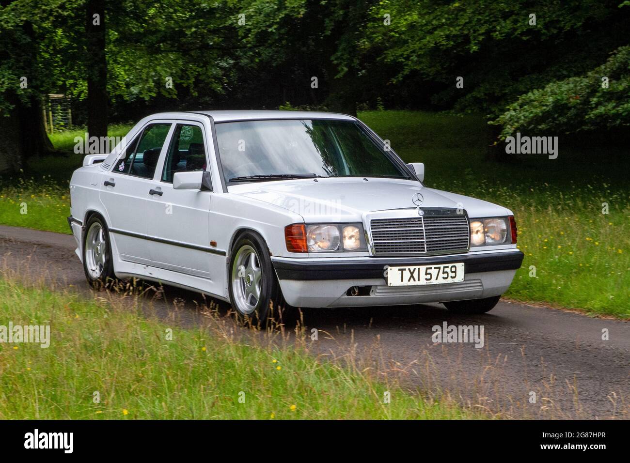 1998 80s white Mercedes Benz Base 4 speed autumatic 1997cc at ‘The Cars the Star Show” in Holker Hall & Gardens, Grange-over-Sands, UK Stock Photo