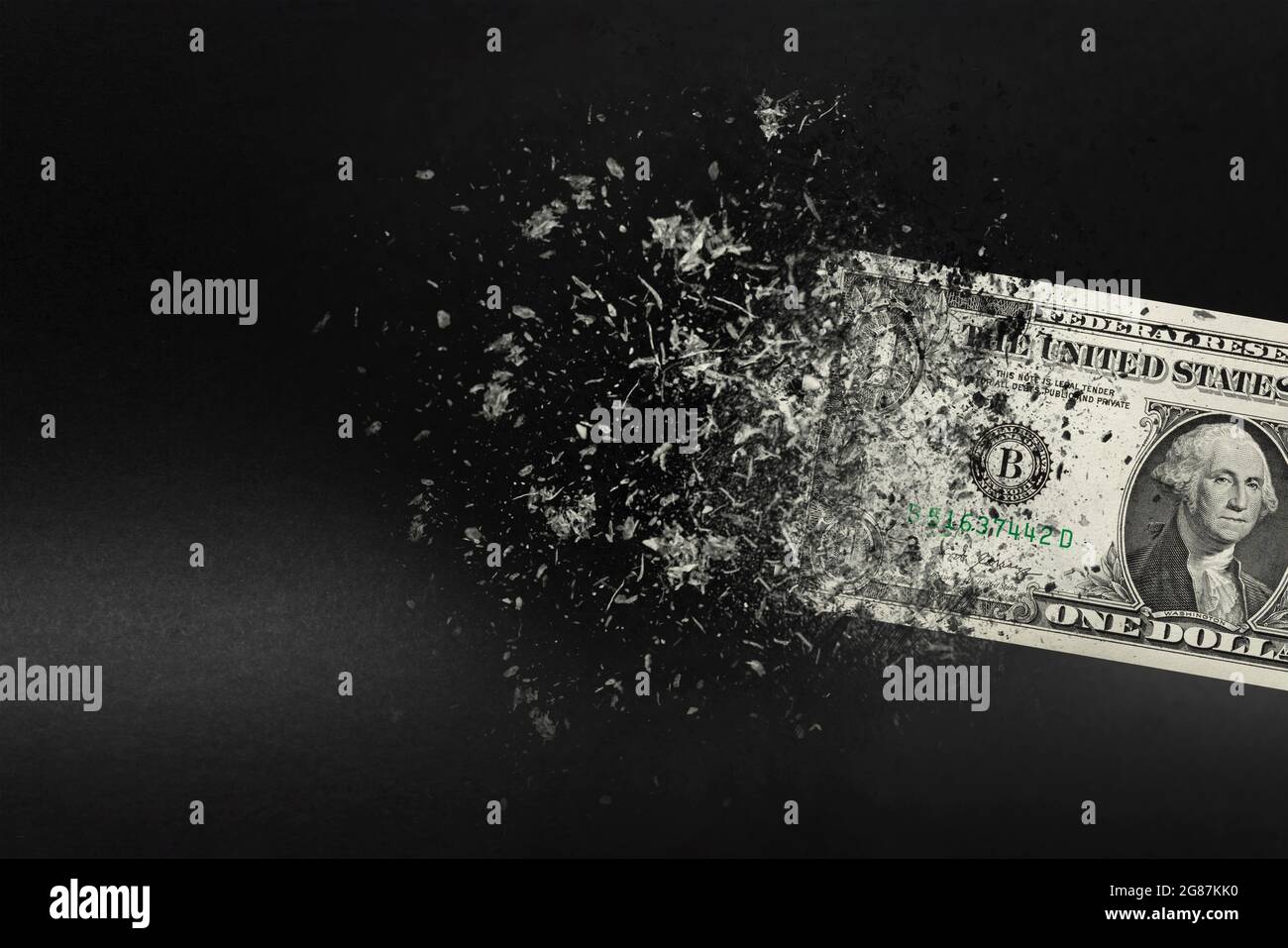 Inflation, dollar hyperinflation with black background. One dollar bill is sprayed in the hand of a man on a black background. The concept of Stock Photo