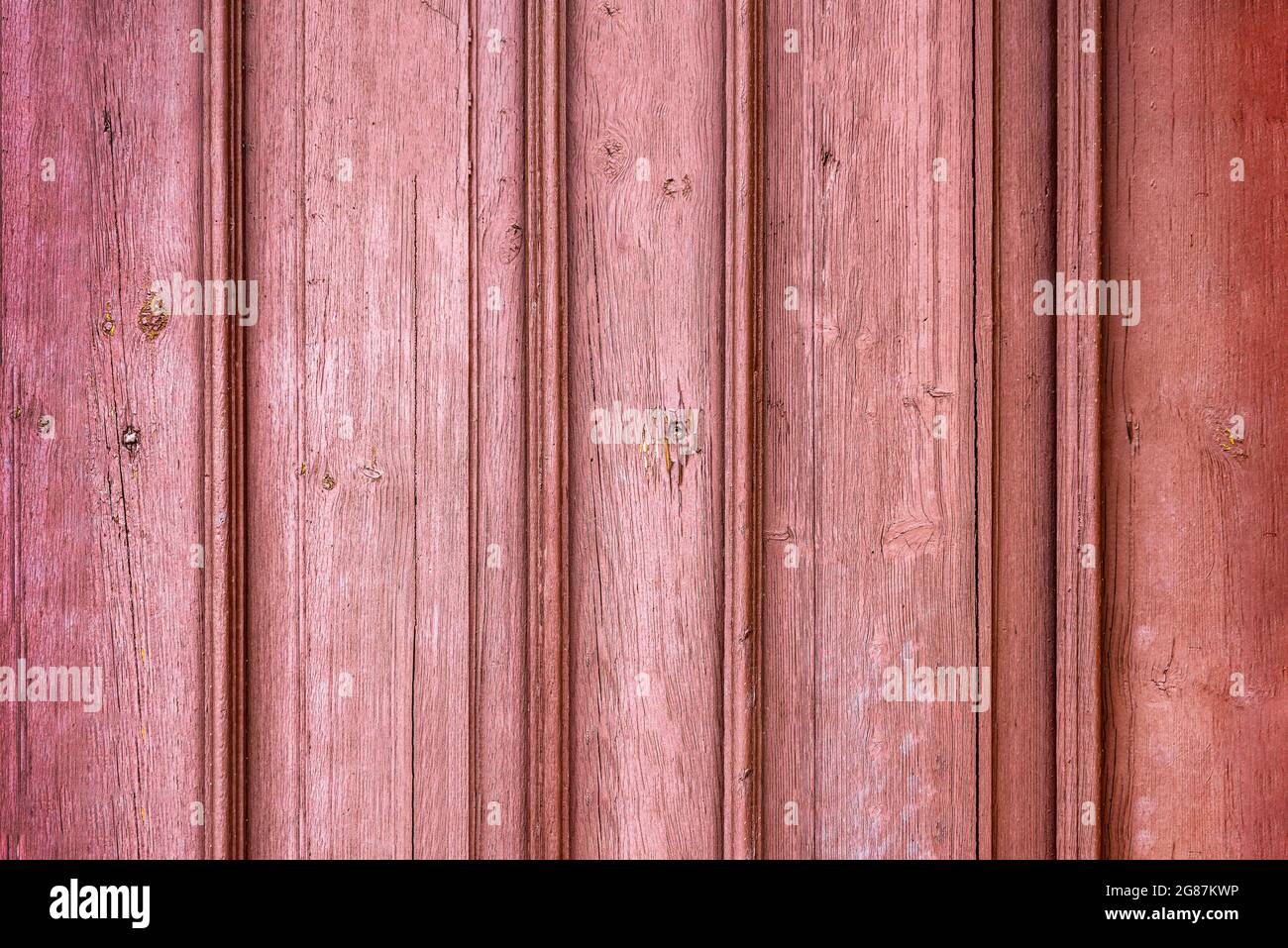Red wood planks or fence texture background or backdrop with old paint. Background for design or postcards Stock Photo