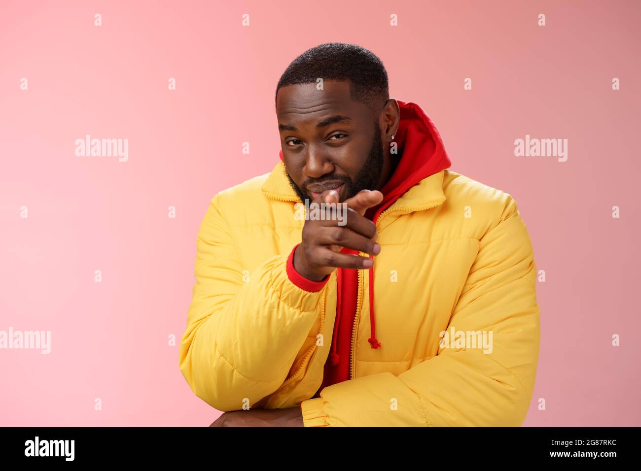 Guy suspecting you pointing camera index finger squinting disbelief unsure, standing pink background asking question look doubtful hesitant, express Stock Photo