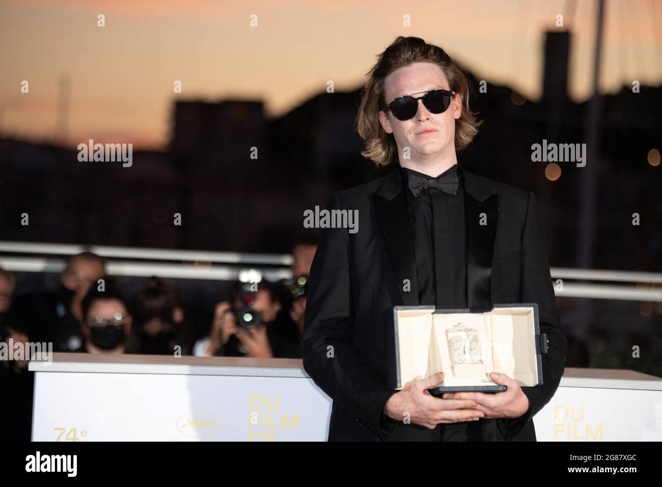 Caleb Landry Jones poses with the Best Actor Award for Nitram during