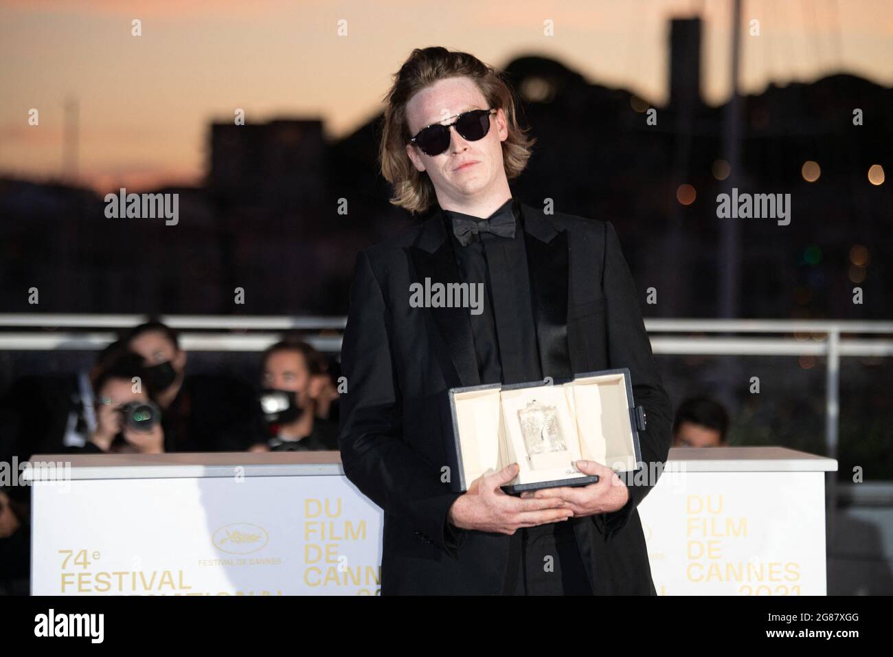 Caleb Landry Jones poses with the Best Actor Award for Nitram during